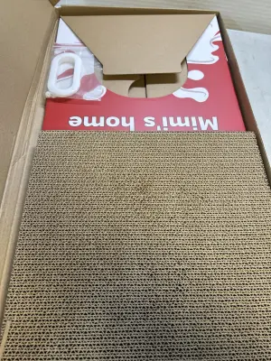 cat house with cardboard scratcher