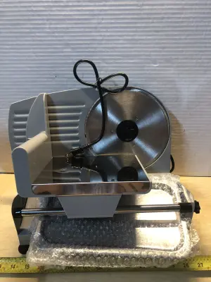 Borlebbi electric food slicer comes on has a dent and scratch in plate